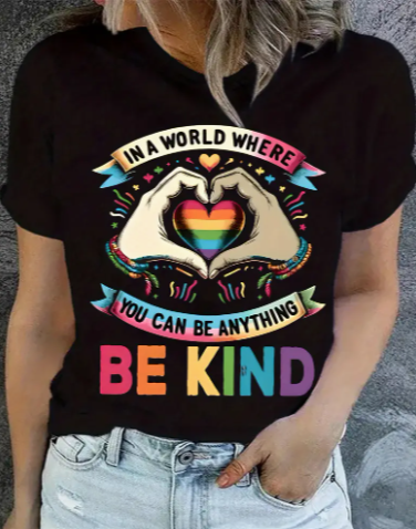 🌈Be kind. Wear kindness. Our black short-sleeve top with a vibrant rainbow heart design